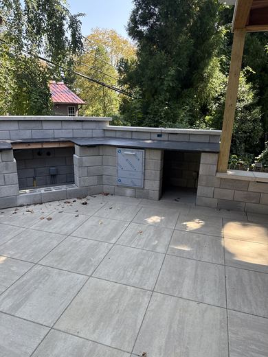 Outdoor kitchen under construction on a paver patio, RDH Construction