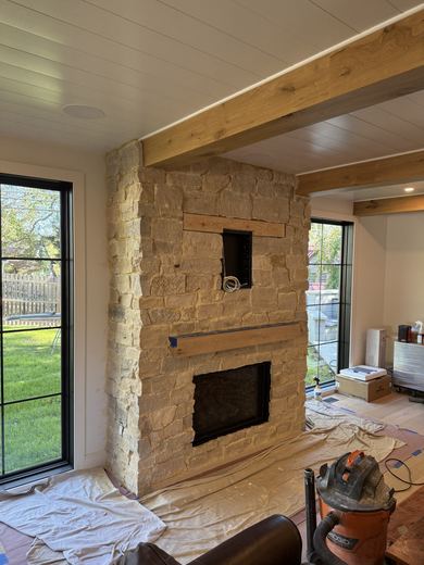 Stacked-stone fireplace and beamed ceiling, in progress, RDH Construction