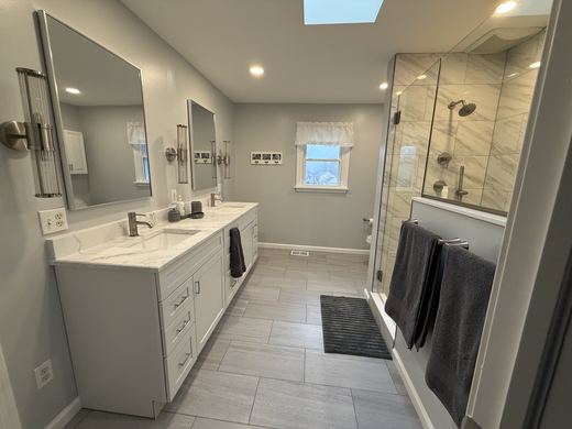 Master bath with double vanity and glass shower, remodel by RDH Construction