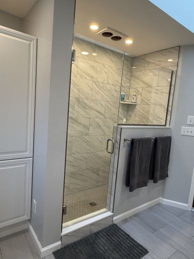 Glass-enclosed shower in a remodeled master bath, RDH Construction