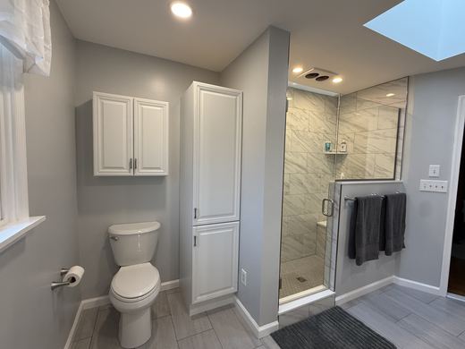 Master bath toilet area and linen cabinet, remodel by RDH Construction