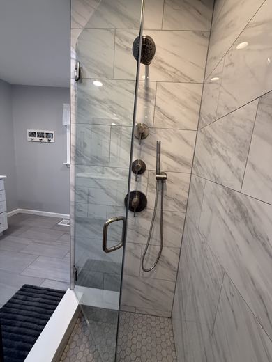 Walk-in shower with frameless glass, remodel by RDH Construction