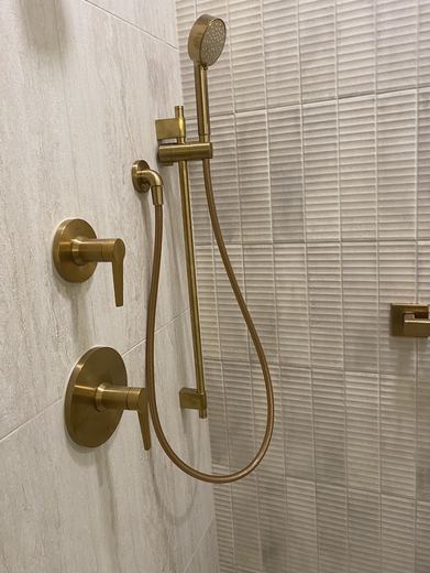Brass shower valve and handheld shower, bathroom remodel by RDH Construction