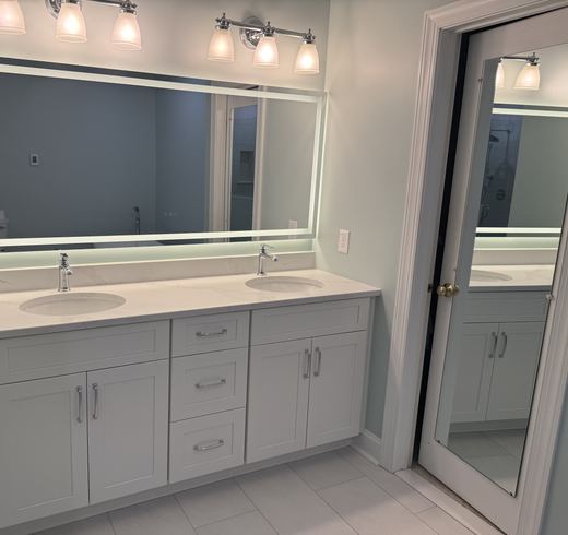 Master bath double vanity with lighted mirror, remodel by RDH Construction