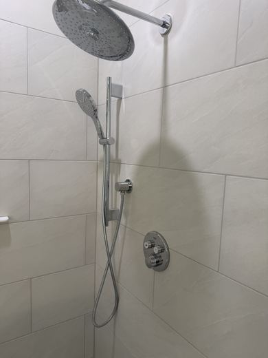 Shower with rain head and handheld shower, remodel by RDH Construction
