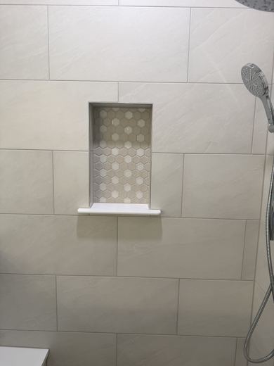 Tiled shower niche, remodel by RDH Construction